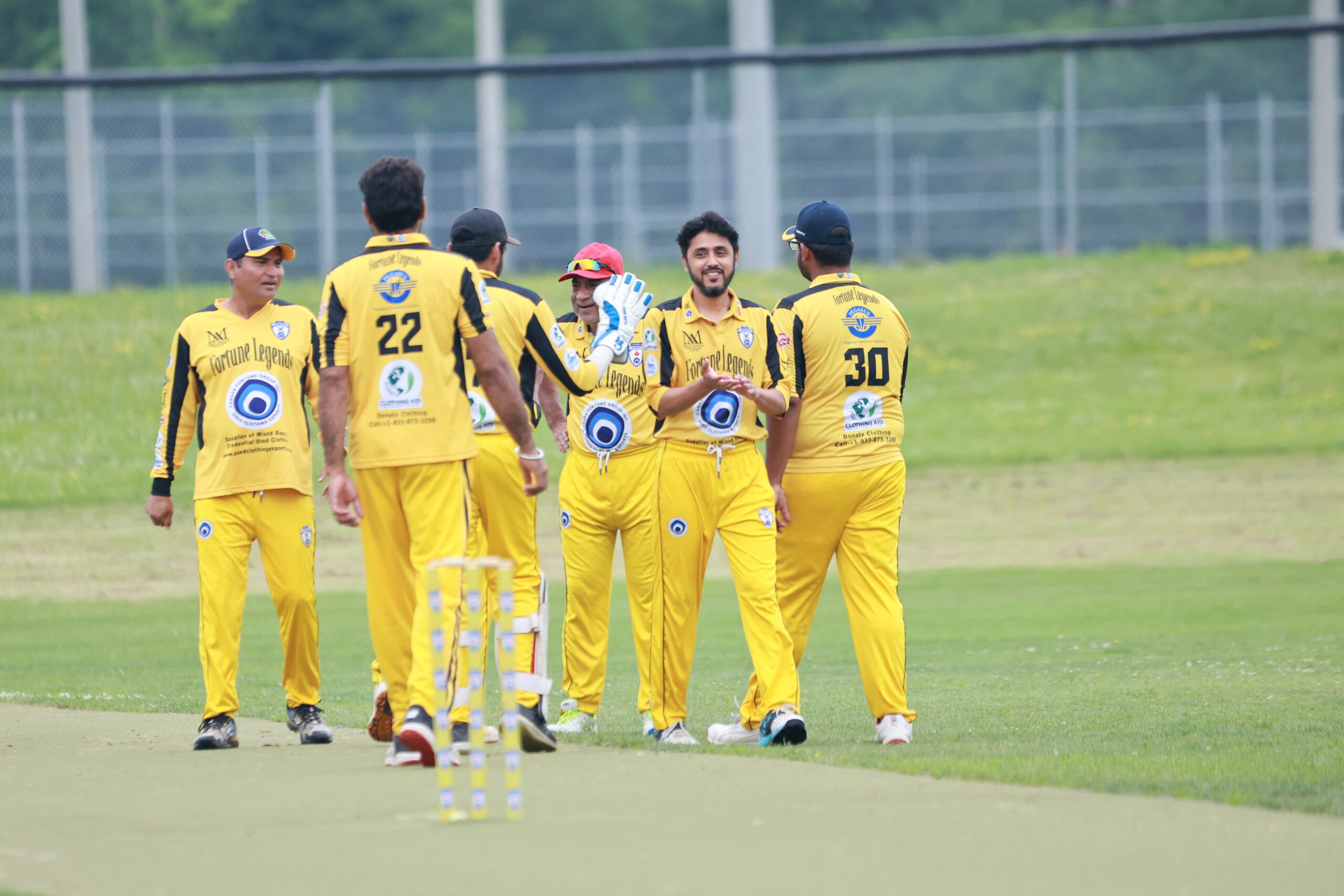 Fortune Legends players huddling on the field mid-match